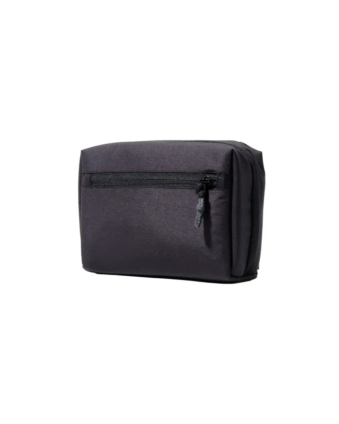 Exterior back view of the black SYMA ARK travel tech organizer closed, highlighting the horizontal zipper pocket for quick access