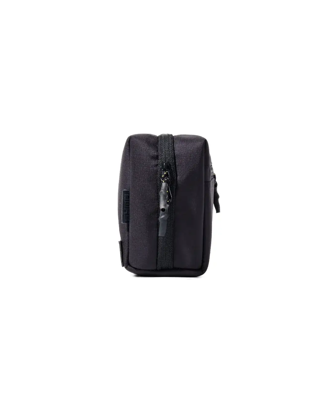 Side profile view of the black SYMA ARK travel tech organizer closed, displaying its compact depth and custom YKK zipper puller