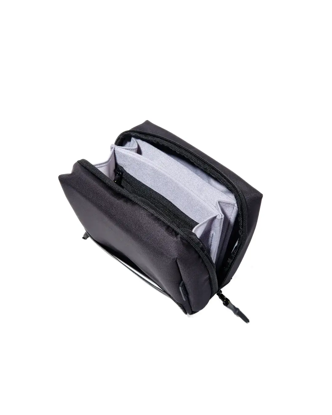 Top-down view of the open SYMA ARK travel tech organizer, revealing the empty grey anti-scratch flannelette interior compartments
