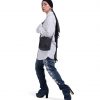 Full-body side view of a female model in modest urban streetwear wearing the black SYMA Sense Sling Bag, demonstrating its compact scale and quick-access closure. Minimalist drawstring sling bag.