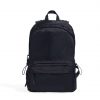 Straight front view of the black SYMA Foyer highlighting its clean utilitarian silhouette, large main compartment, and heavy-duty nylon exterior. 16 inch commuter backpack.