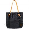 Front vertical view of the 9L black SYMA Noble minimalist everyday tote bag, highlighting the nylon crinkle fabric, contrasting orange paracord shoulder straps, front vertical webbing, and dual external mesh water bottle pockets
