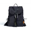 Front view of black SYMA Adore Backpack highlighting V-shaped webbing and tactical carabiner. Compact everyday backpack