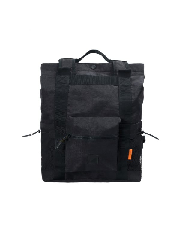 Front view of the black SYMA Chorus 17L 2-way backpack tote, displaying its textured nylon exterior, front zipper pocket for daily essentials, vertical 2cm nylon webbing, and dual side mesh water bottle pockets