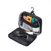 High-angle open interior view of the black SYMA Refine Toiletry Kit suspended by its built-in hook, demonstrating its organized compartments filled with grooming essentials like bottles and a razor inside zippered mesh pockets. Compact hanging toiletry bag.