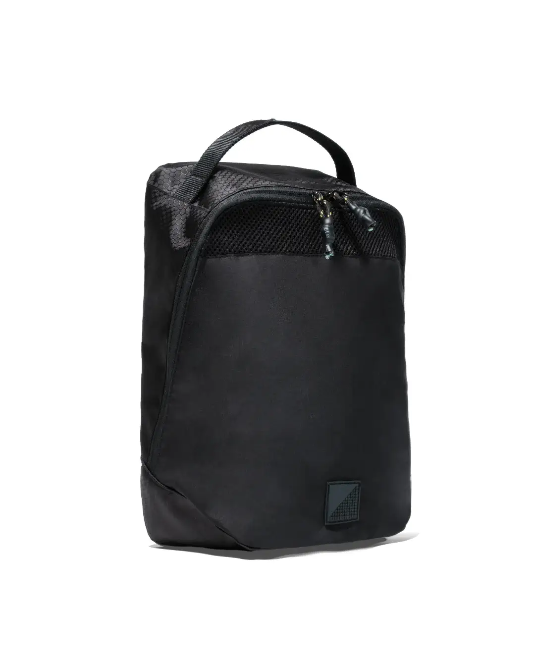 Angled front view of black SYMA Cubic highlighting its top grab handle, upper mesh ventilation panel, and textured fabric details. Ventilated travel shoe bag.