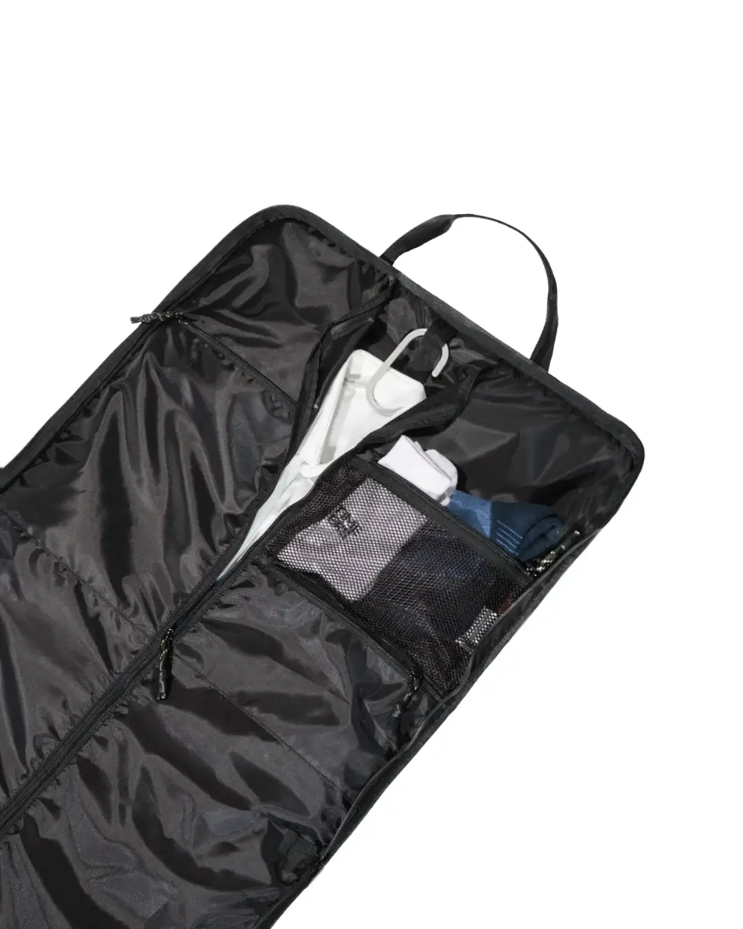Angled interior view of the open black SYMA Motion revealing a hanger loop holding a white shirt and a zippered mesh pocket storing folded accessories. Travel garment bag.