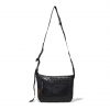 Straight suspended front view of the black SYMA Strings Sling Bag highlighting its structured PE Tarpaulin top panel, zippered front mesh pocket, and adjustable strap. Small urban crossbody bag.