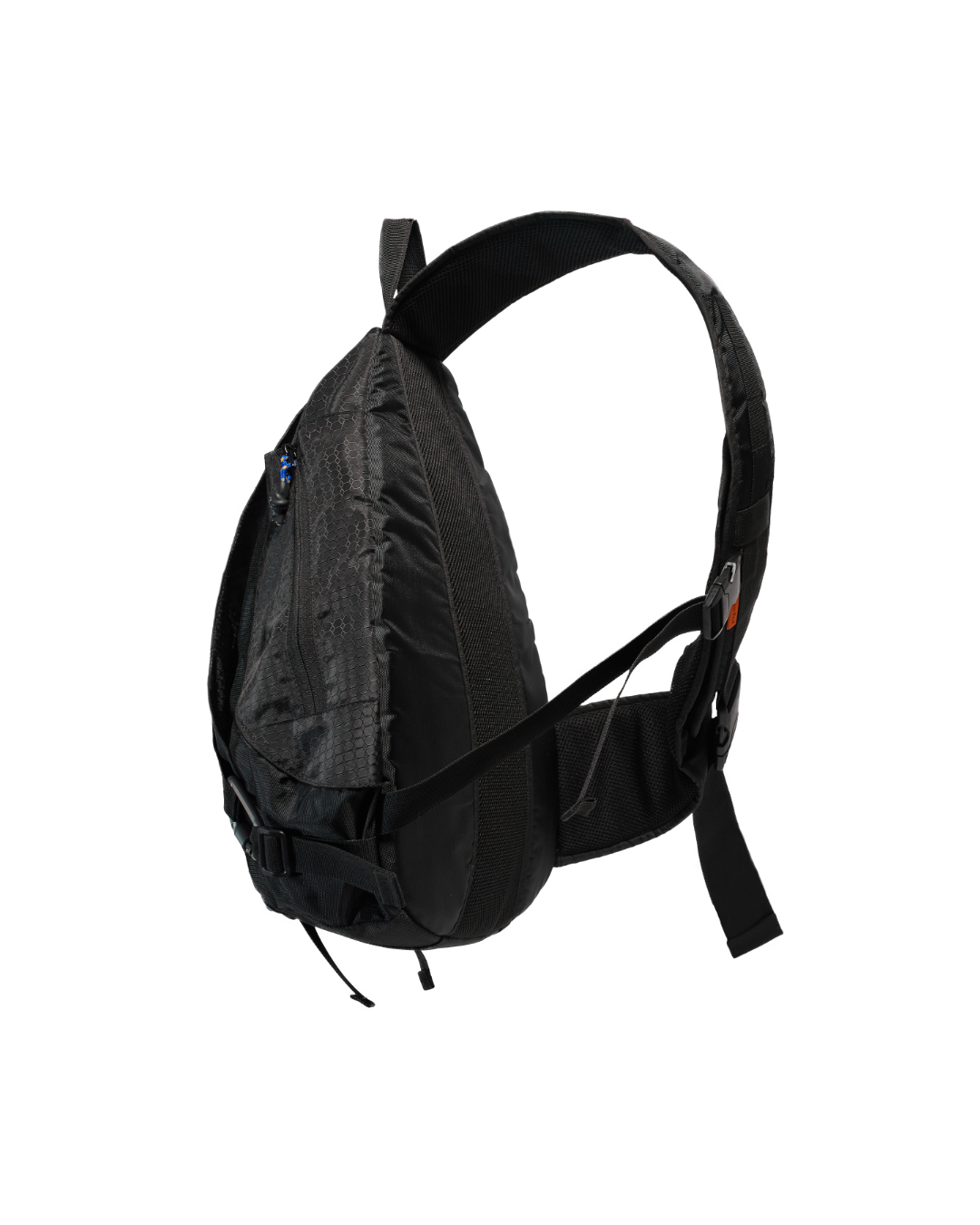 Angled suspended rear view of the black SYMA Symmetry Crossbody Bag highlighting its wide padded shoulder strap, ergonomic harness system, and hexagon ripstop exterior. Large techwear crossbody bag.