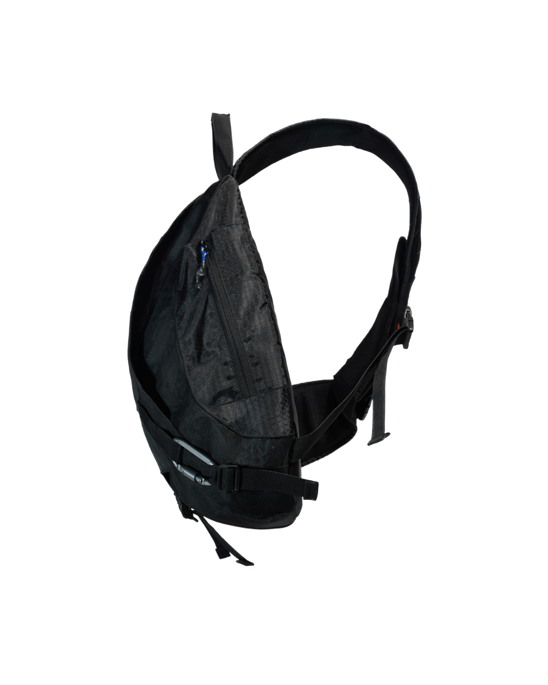 Angled suspended side profile of the black SYMA Symmetry Crossbody Bag, showcasing its technical zippered front pocket, weather-resistant fabric flaps, and metal carabiner attachment. Large techwear crossbody bag.