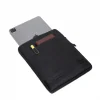 Angled top view of the black SYMA Opus with an iPad Pro partially inserted, highlighting its front pocket holding a notebook and pen. Tactical 11 inch tablet sleeve.