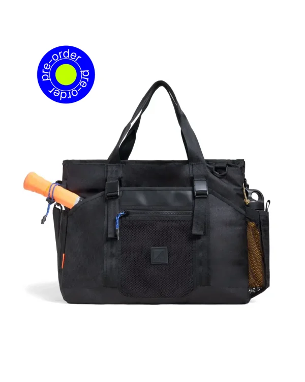 SYMA. Miles Racket-Tote Black worn by man carrying racket. Premium urban utility padel & tennis bag