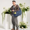 Smiling man in smart casual attire wearing SYMA Fable Sling Bag Navy on shoulder. 16L everyday commuter sling bag