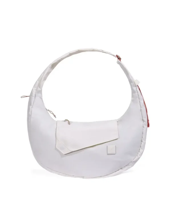 Front view of SYMA Fable Sling Bag Light Cream showing silent magnetic flap. Minimalist everyday sling bag