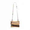 Front suspended view of the SYMA Mantra khaki sacoche bag, highlighting its durable polyester ripstop exterior, dual front zipper pockets with orange pullers, bottom mesh detailing, and adjustable removable strap