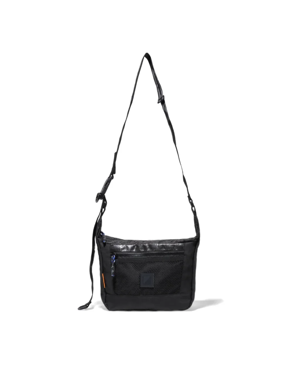 Straight suspended front view of the black SYMA Strings Sling Bag highlighting its structured PE Tarpaulin top panel, zippered front mesh pocket, and adjustable strap. Small urban crossbody bag.